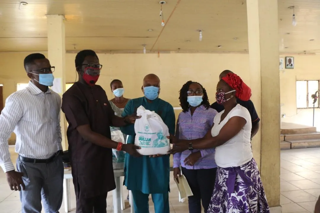group of people handing off materials