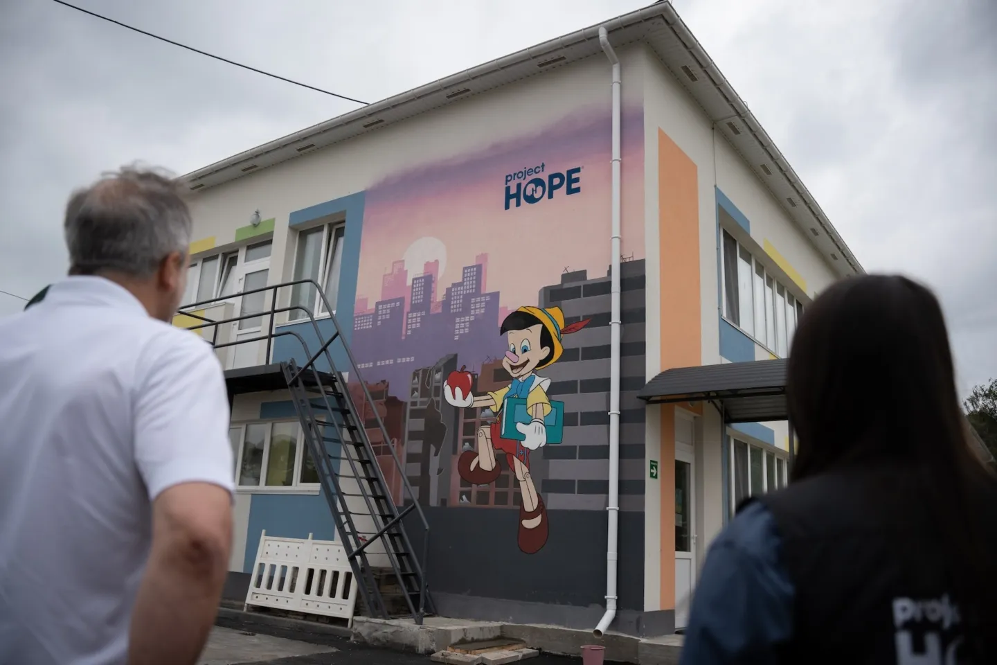 side of building with a mural of Pinocchio