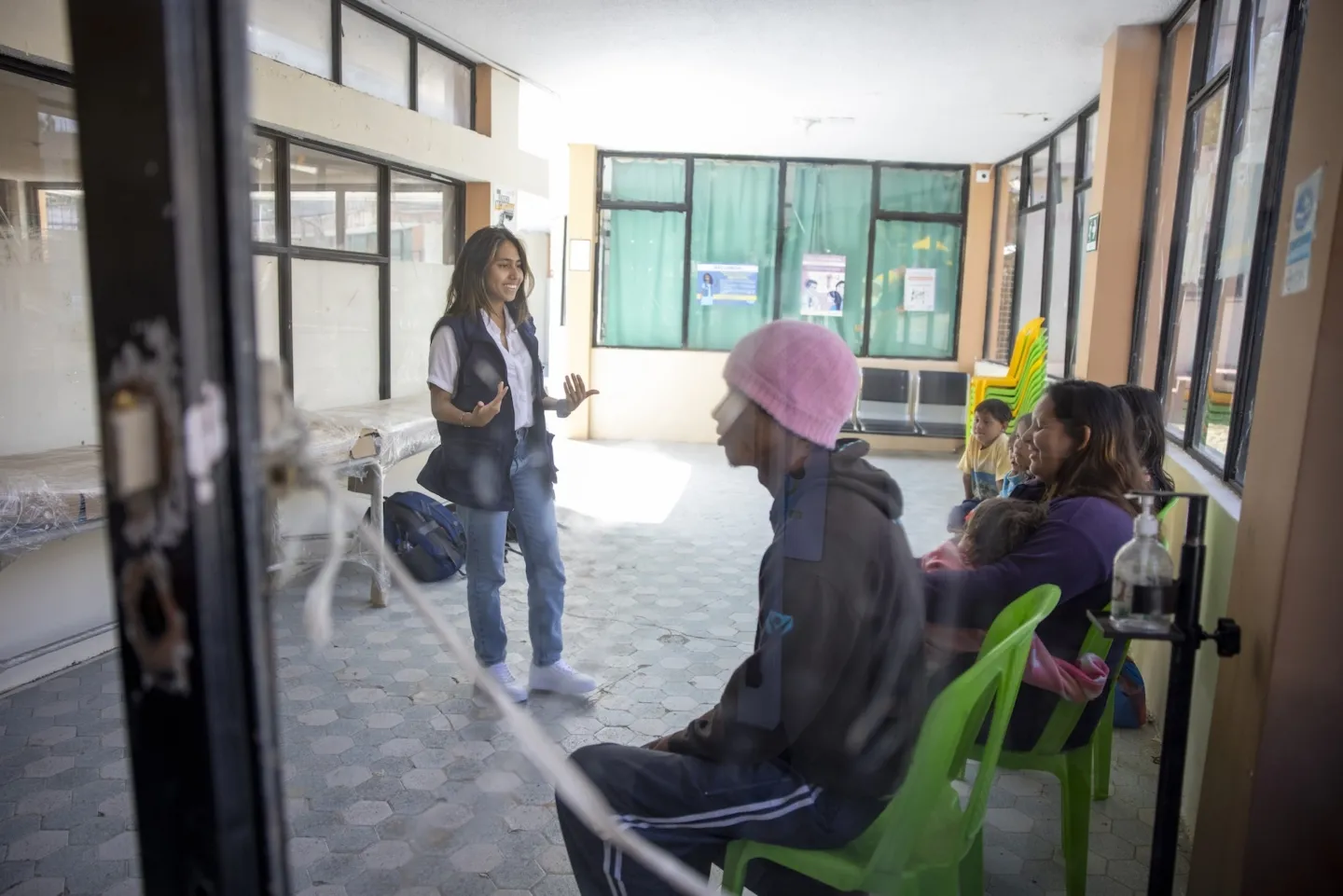 woman speaks to group about mental health