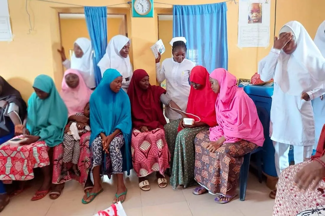 a group of women sitting together in Nigeria