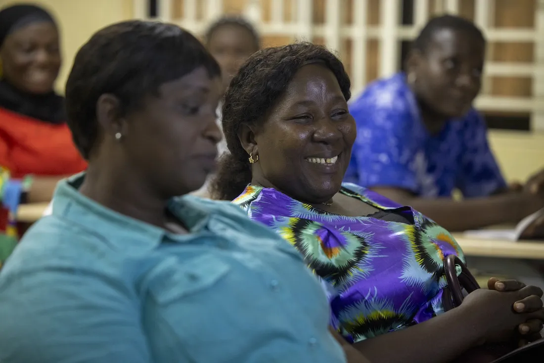 Two women in scrubs attending a midwife training