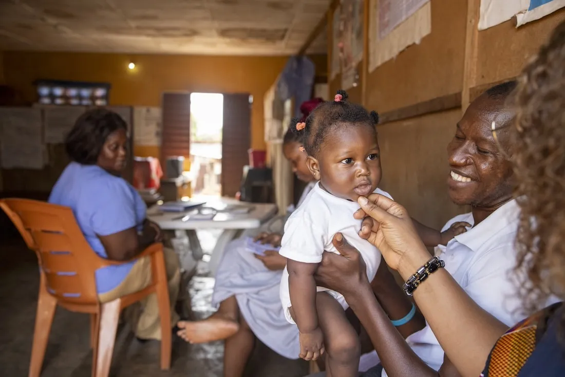 woman holding baby in Sierra Leone