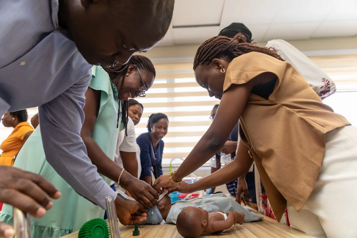 Group of medical nurses training how to handle newborns in neonatal workshops in Ghana