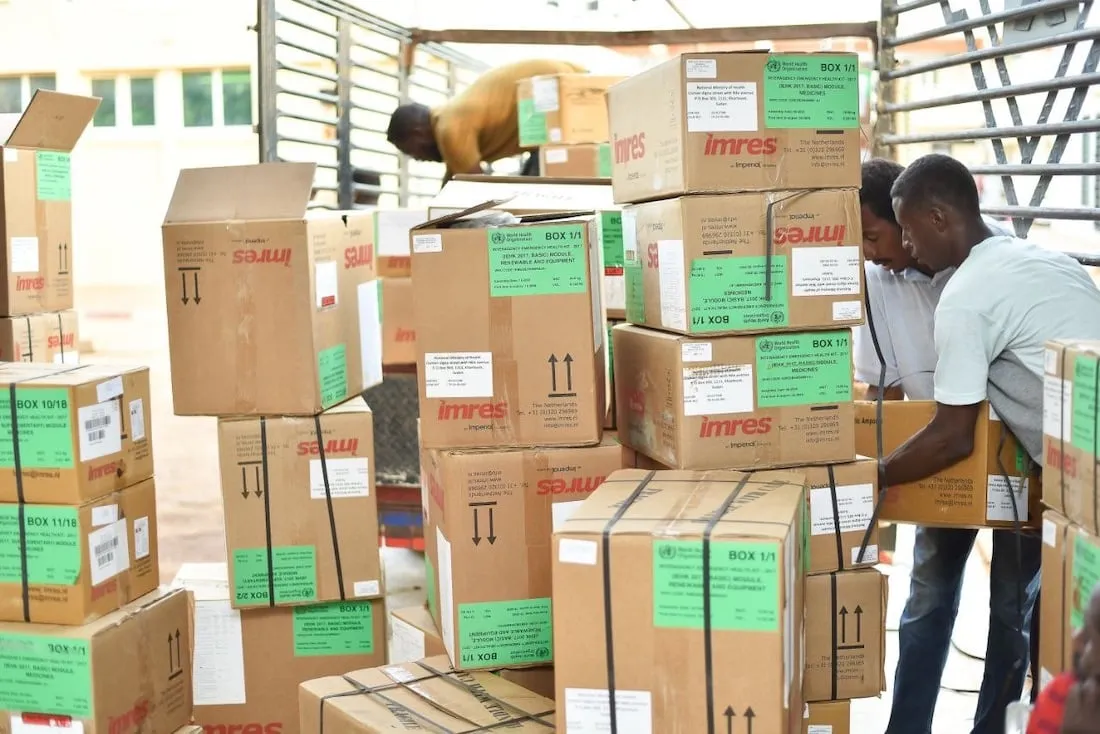 men unloading boxes of relief