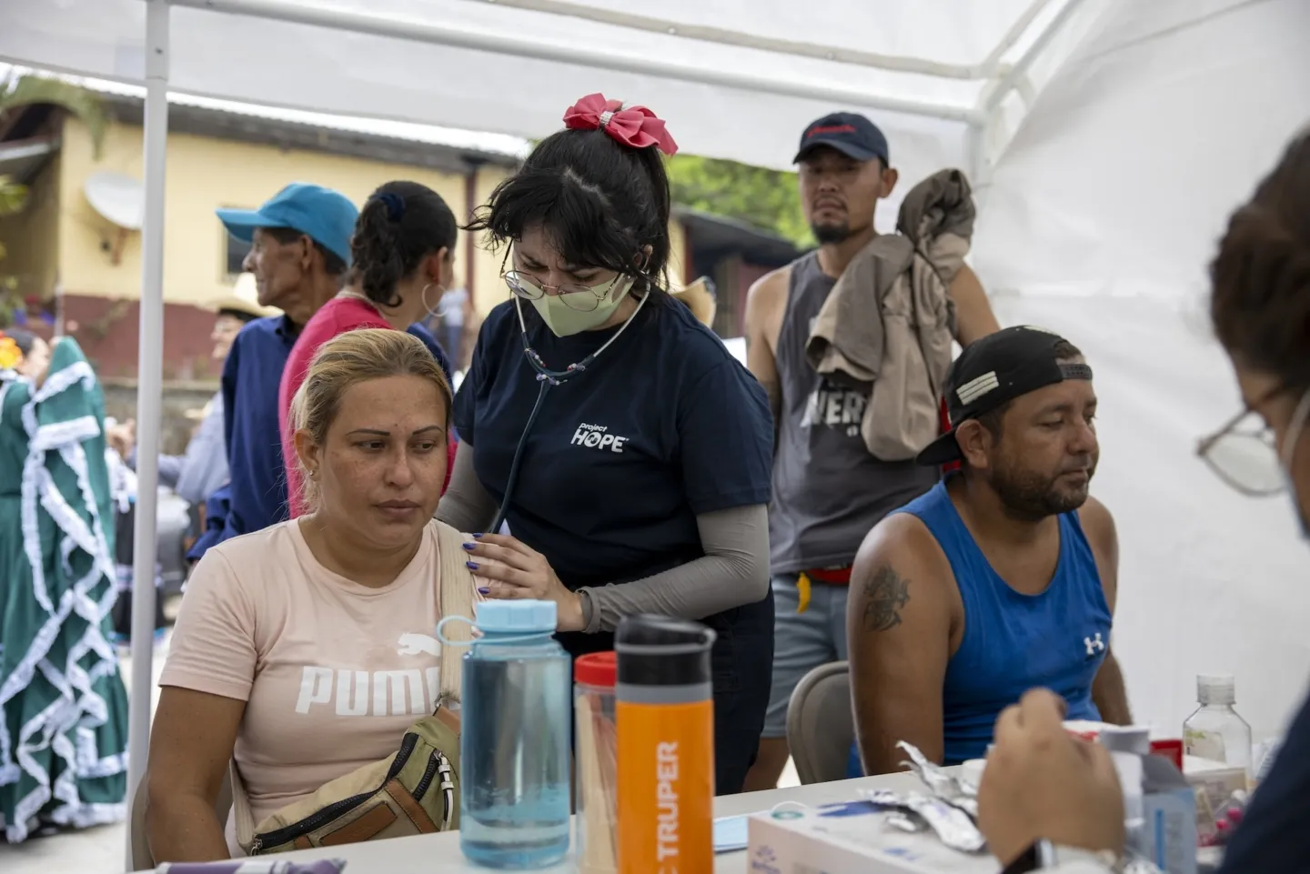 medical staff check breathing of patient in Honduras