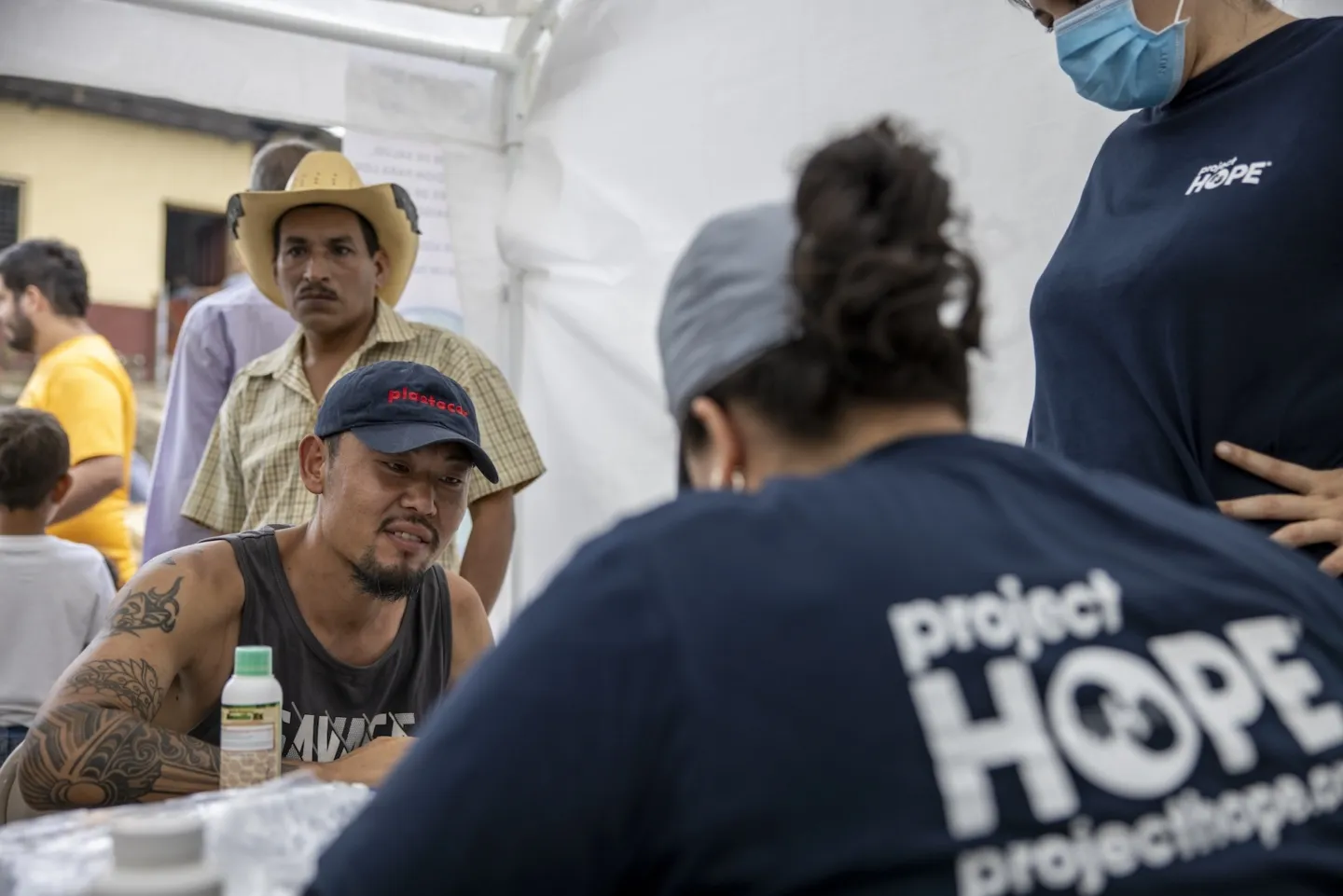 medical staff speak with man in Honduras