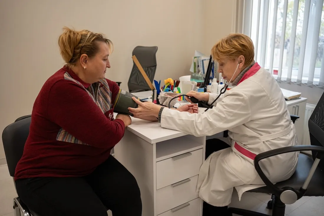 Woman receives care from a doctor