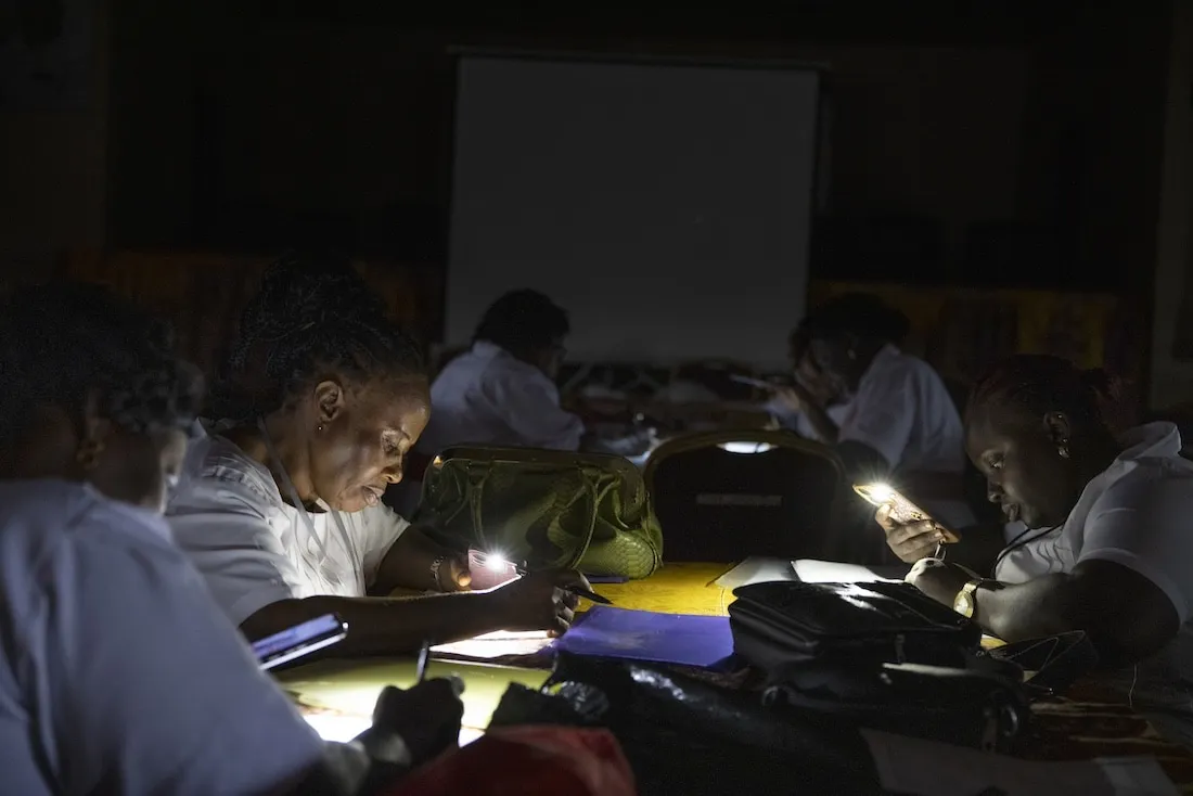 midwives take a test using flashlights