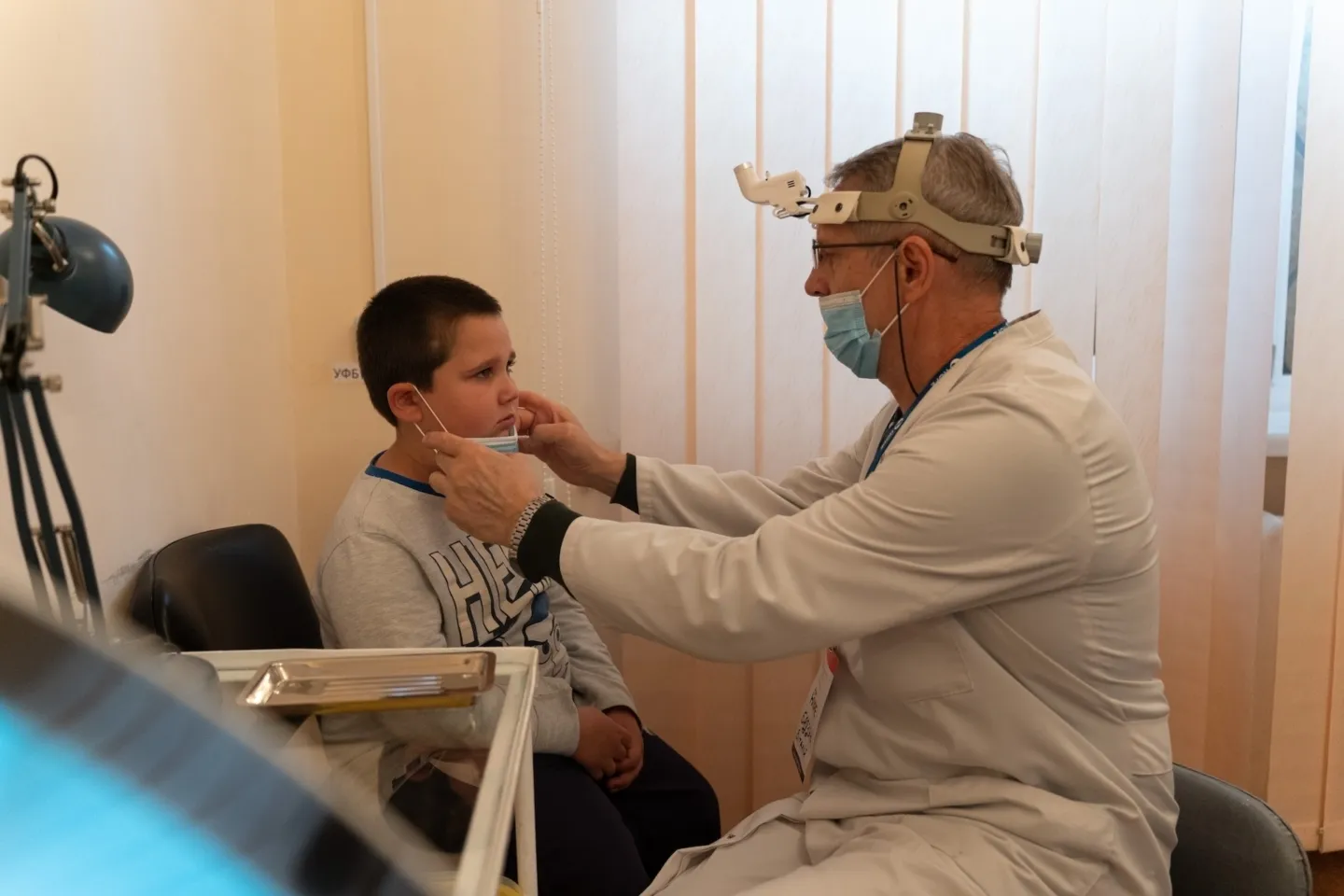 child being examined by doctor