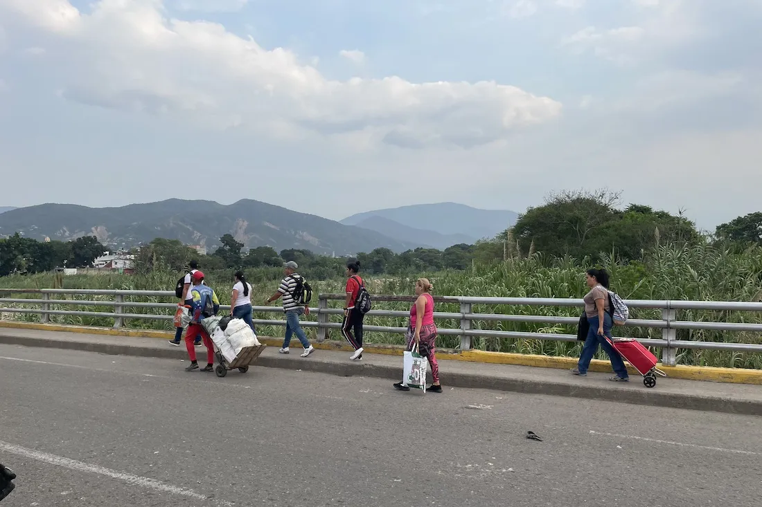 Venezuelans cross back over the border before it closes.