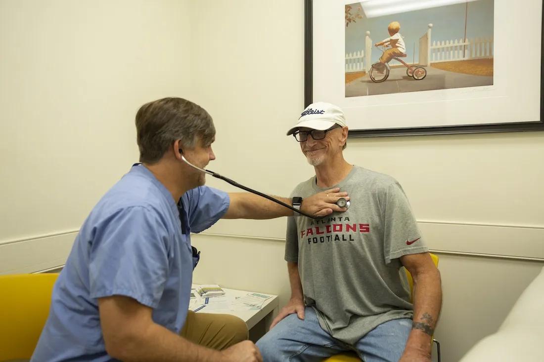 Lamar with the doctor at MercyMed in Columbus