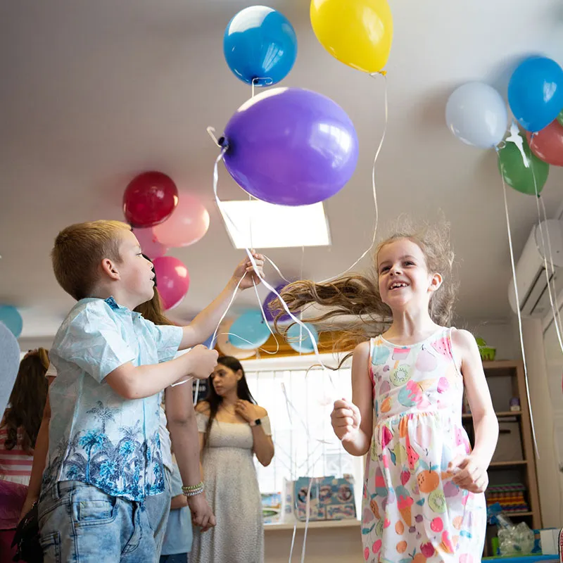children playing with balloons
