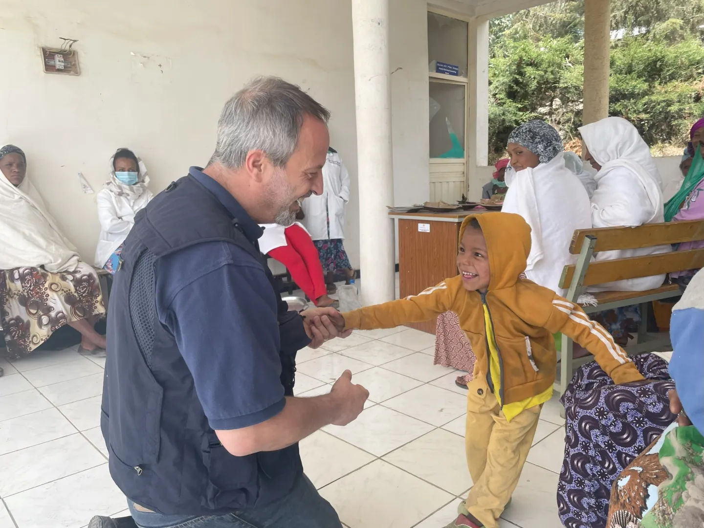 man and little boy dancing