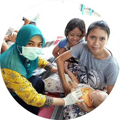 nurse with mother and two children